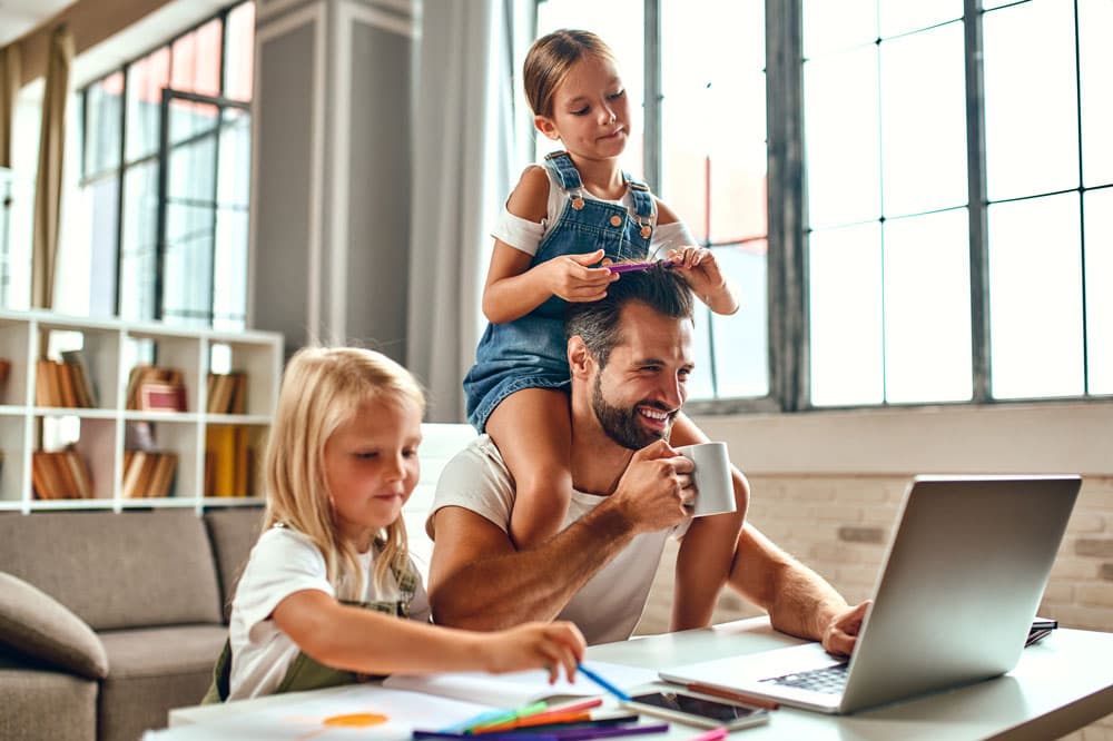 People looking at homes online on a laptop